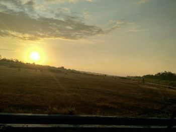 Scenic view of landscape at sunset