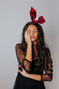 Portrait of a beautiful young woman over white background