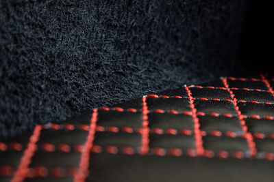 Close-up of red light painting on carpet