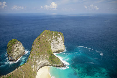 High angle view of rocks in sea against sky