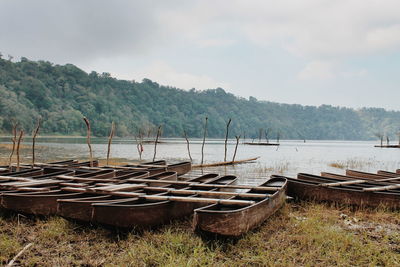 An old wooden fisherman boat the lakeside