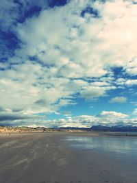 Scenic view of sea against cloudy sky