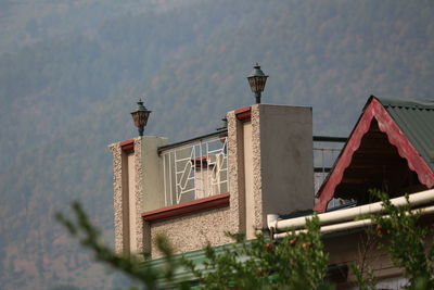 Low angle view of roof and building against sky