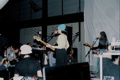 Group of people playing piano