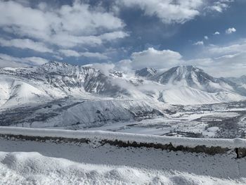 Scenic view of snowcapped mountains against sky