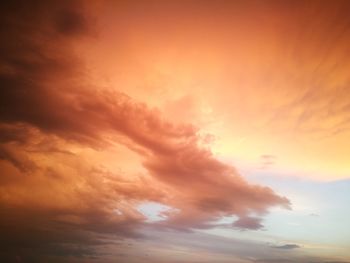 Low angle view of cloudy sky at sunset