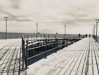 View of pier on sea against sky