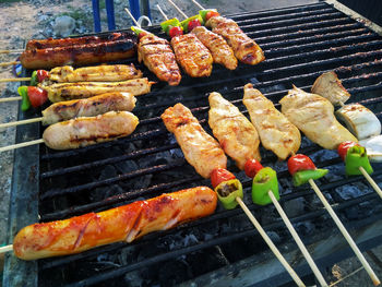 High angle view of meat on barbecue grill