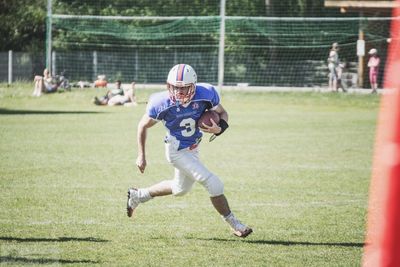 Boy running in park