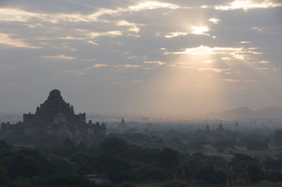 Panoramic view of temple against sky during sunset
