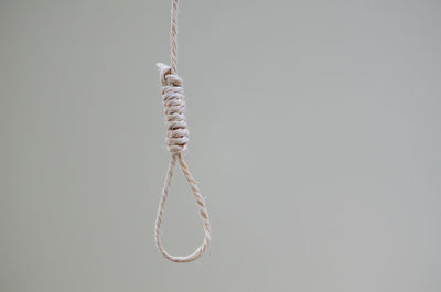 Hanging noose rope against white background