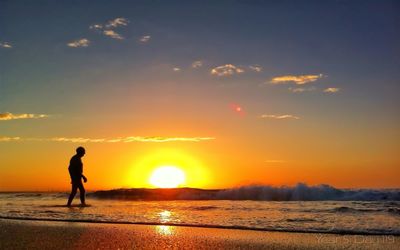 Scenic view of sea at sunset