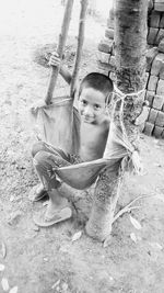 Portrait of boy wearing sunglasses on land