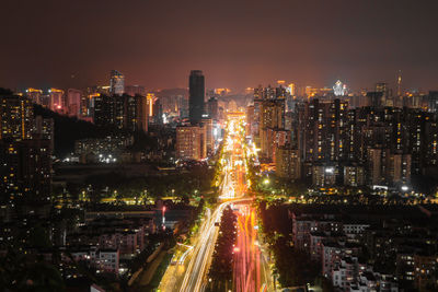 Aerial view of illuminated buildings in city at night