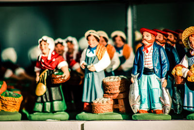 Close-up of figurines for sale at shop during christmas