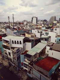 High angle view of buildings in city against sky