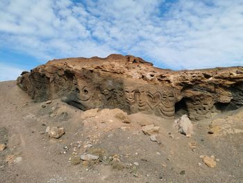 Low angle view of rock formations against sky