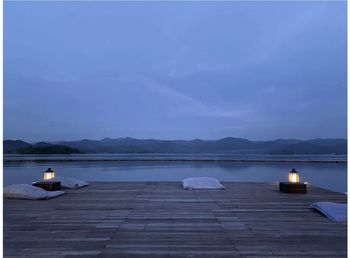 Scenic view of sea against sky at dusk