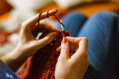 Close-up of woman holding hand