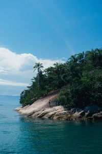 Scenic view of sea against blue sky