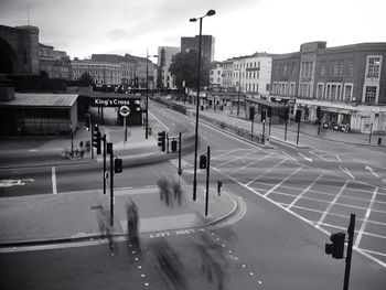 Vehicles on road along buildings