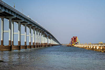  100 years old india's first sea bridge for railway , tall road bridge connecting mainland india. 