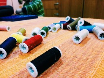 Spools of colorful threads on table