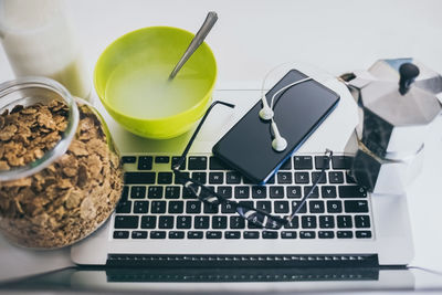 Table set for breakfast. natural meal and technology devices.  home working, remote work concept.