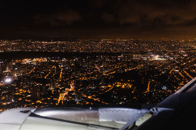 Aerial view of illuminated cityscape at night