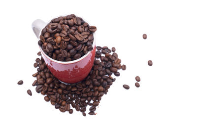 High angle view of coffee beans against white background