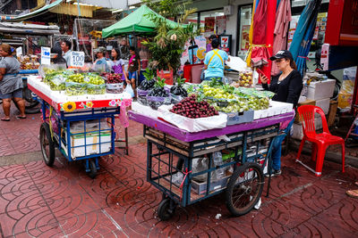 People at market stall