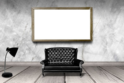 Empty chairs and table against wall at home