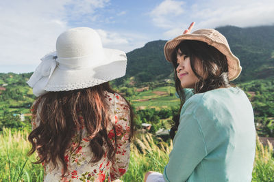 Rear view of woman wearing hat