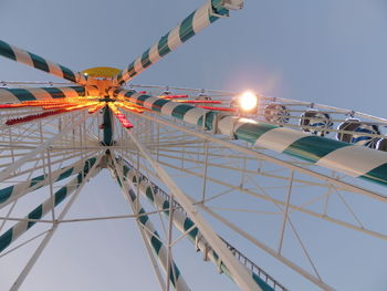 Low angle view of ferris wheel against sky