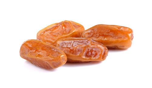 Close-up of orange slice against white background