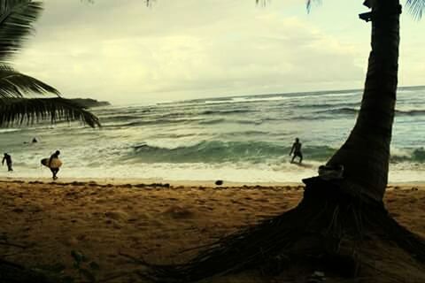 TOURISTS ENJOYING ON BEACH