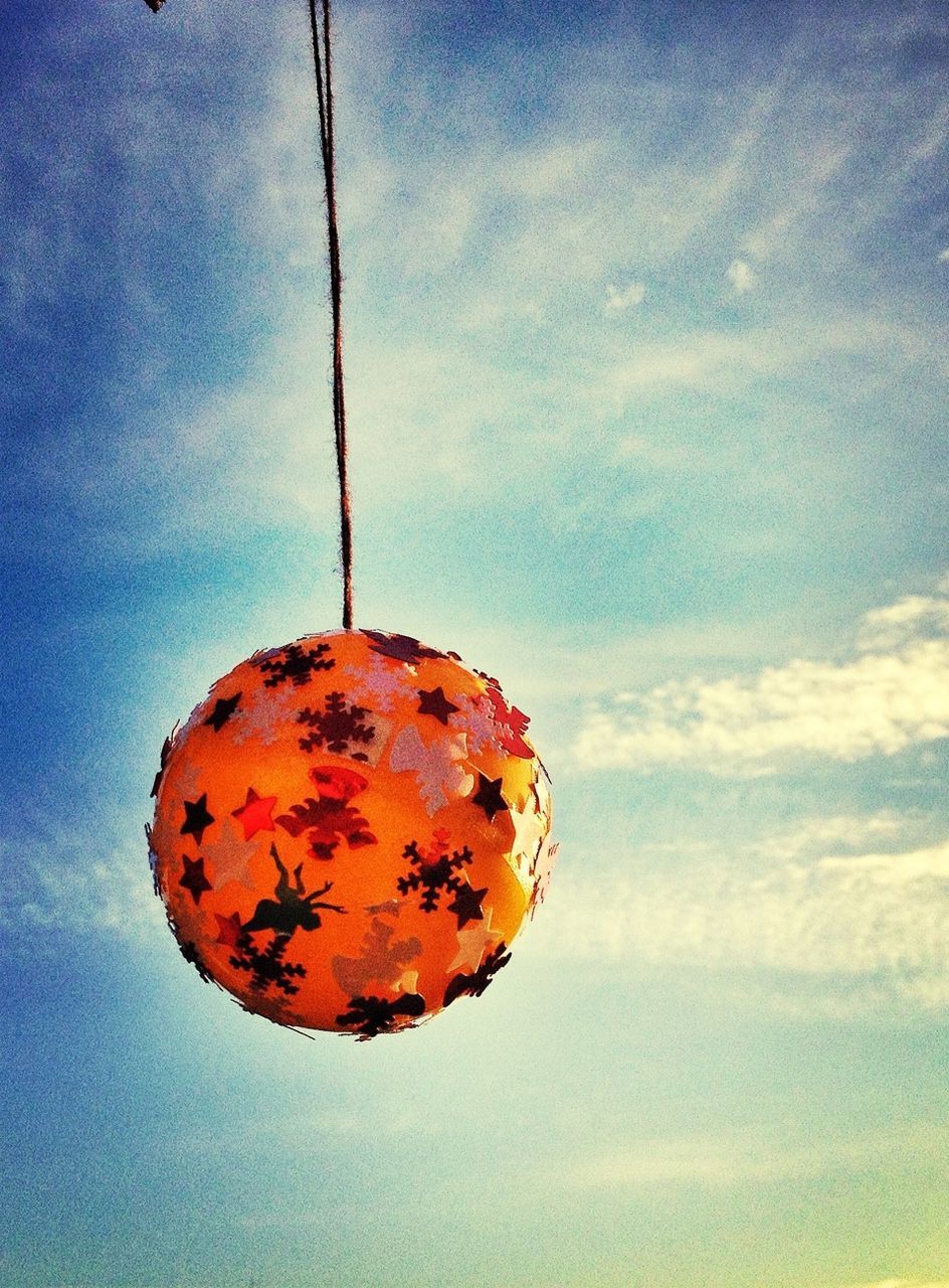 sky, low angle view, cloud - sky, cloud, sunset, blue, hanging, close-up, sphere, nature, outdoors, cloudy, dusk, orange color, no people, lighting equipment, tranquility, red, day, electricity