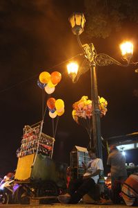 Illuminated ferris wheel at night