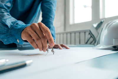 Close-up of man working on table