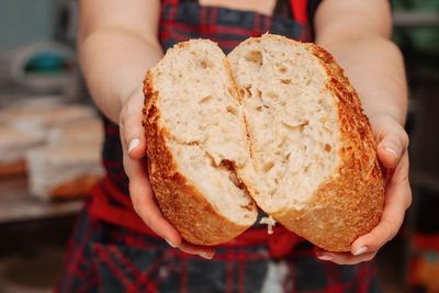 Baker cuts bread