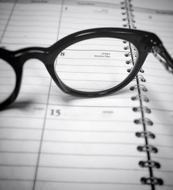 Close-up of eyeglasses on paper