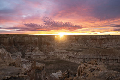 Epic sunrise aerial panorama above massive coal mine canyon on n