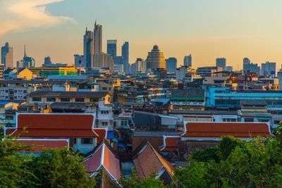 High angle view of buildings against sky during sunset