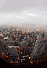 High angle view of modern buildings in city against sky