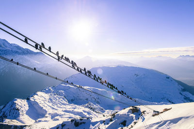 Scenic view of snow covered mountains against sky