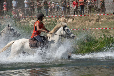 View of people enjoying in river