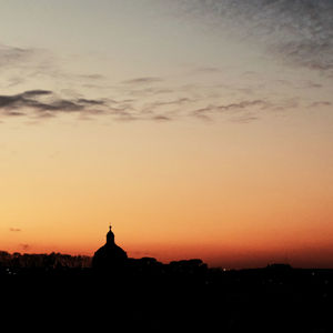 Silhouette of building during sunset