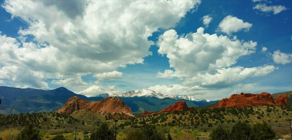 Scenic view of mountains against cloudy sky