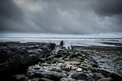 Scenic view of sea against cloudy sky