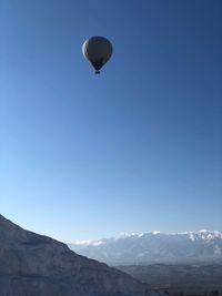 Low angle view of mountain against blue sky